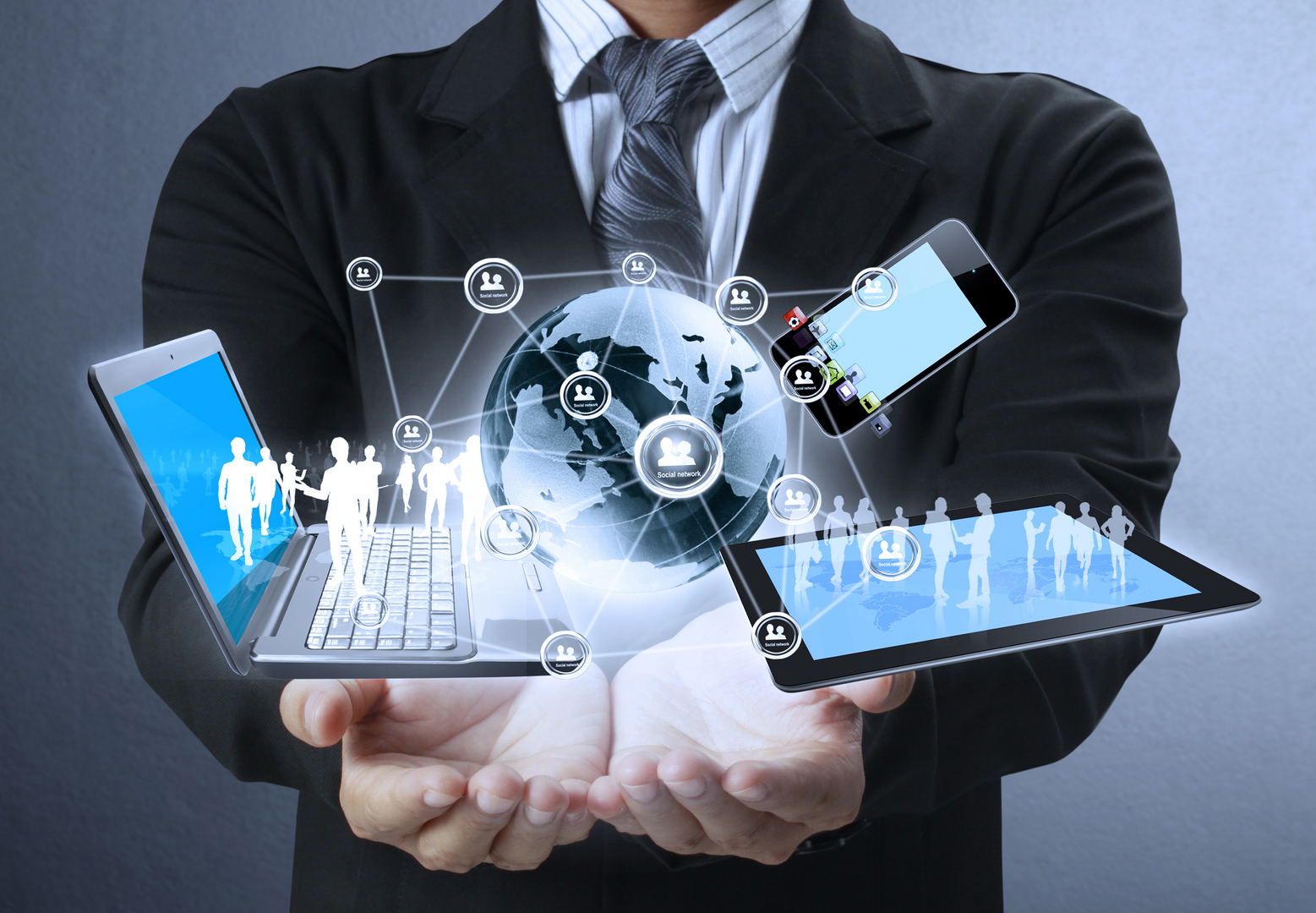 Businessman holding a glowing global network